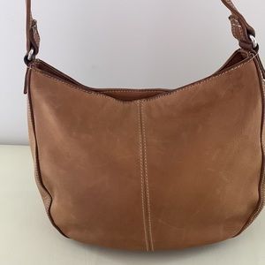 Fossil beige hobo bag w/ cream topstitching. Pockets inside. Single strap.